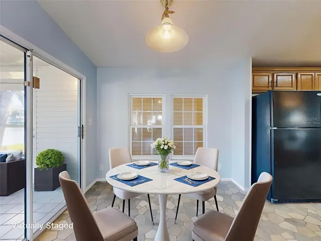 a view of a dining room with furniture window and outside view