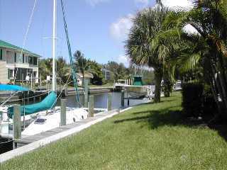 9345 Southeast Delafield Street Hobe Sound, FL 33455 - Photo 2 of 5 a view of a park with large trees
