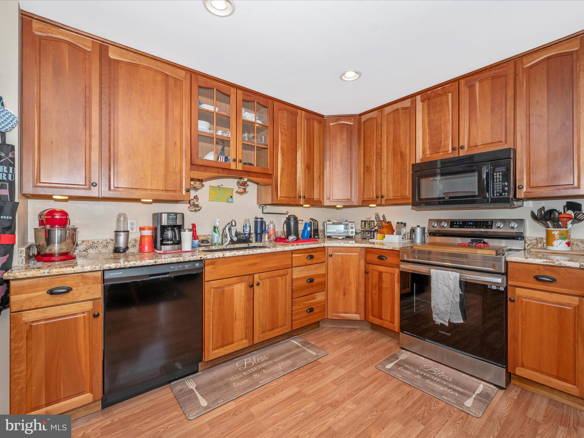 6423 Bikle Road Fayetteville, PA 17222 - Photo 13 of 56 a kitchen with stainless steel appliances granite countertop a stove sink microwave and cabinets