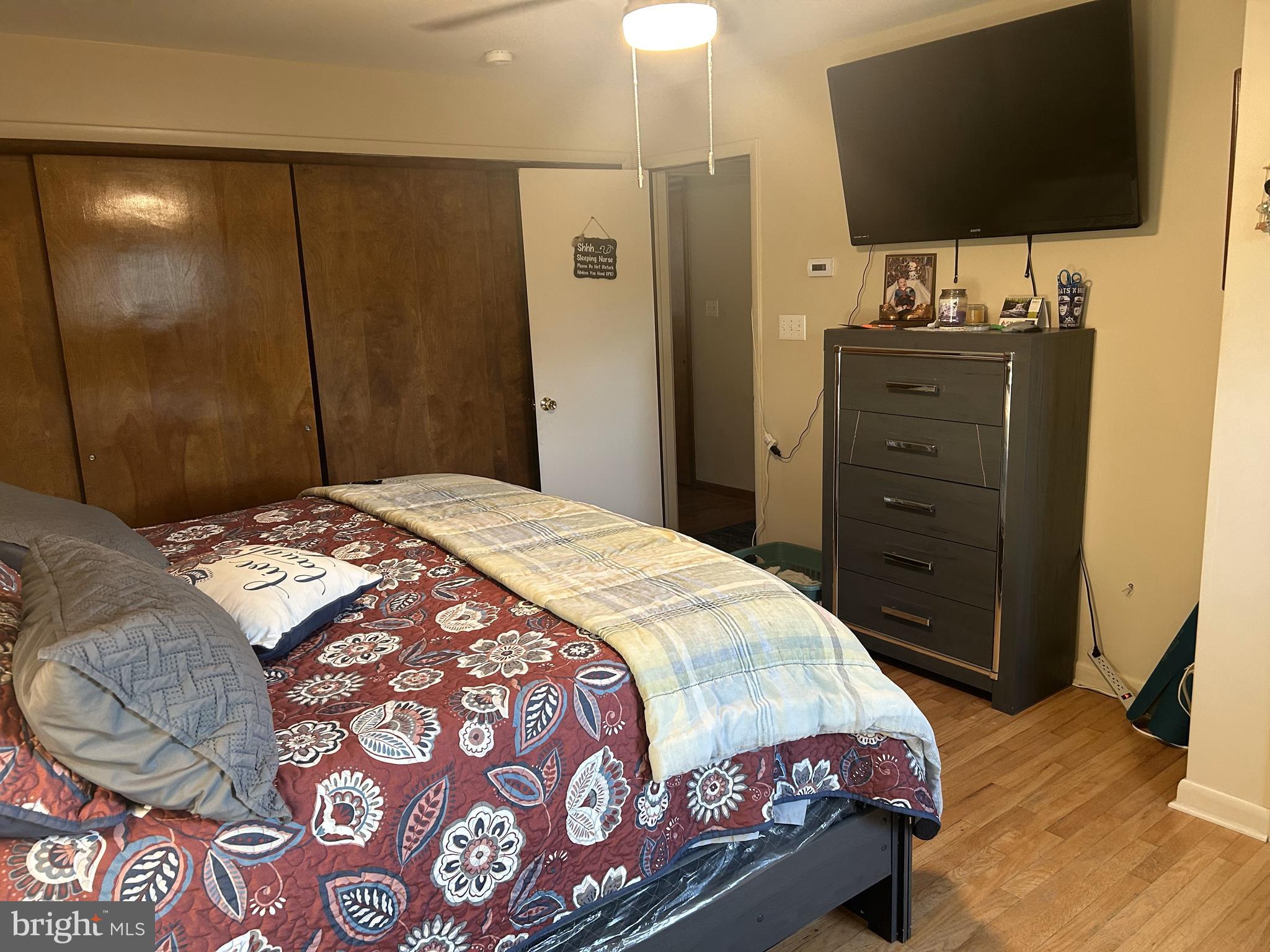 6423 Bikle Road Fayetteville, PA 17222 - Photo 16 of 56 a bedroom with a bed and a flat screen tv