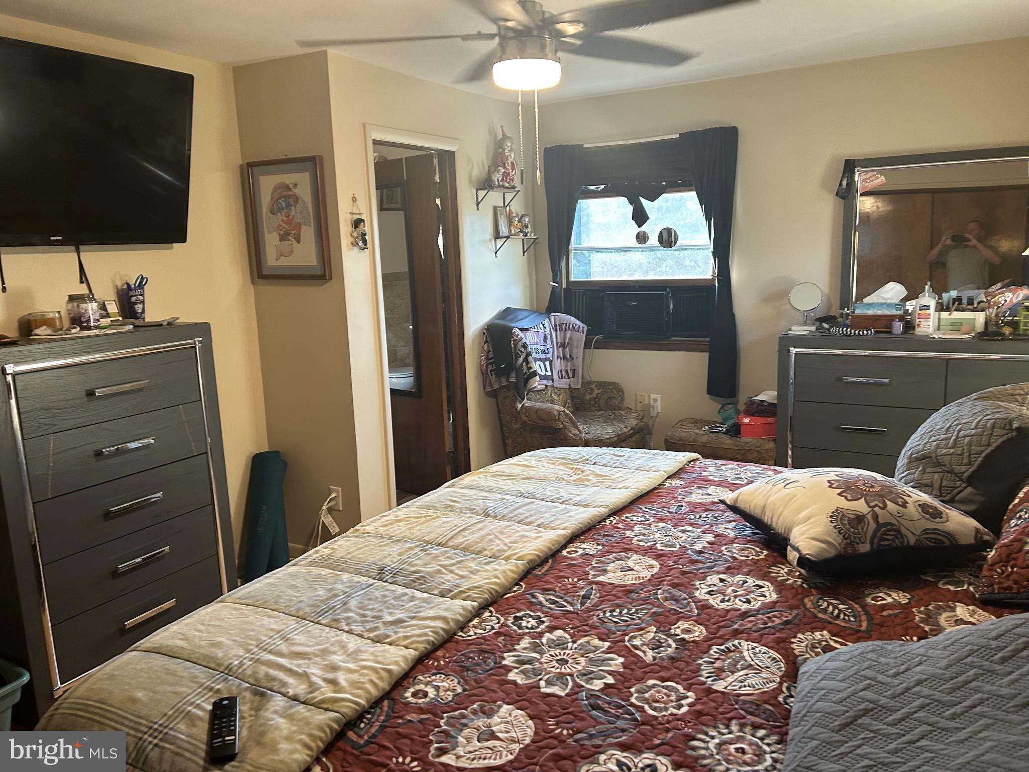6423 Bikle Road Fayetteville, PA 17222 - Photo 17 of 56 a bedroom with a bed and a flat screen tv