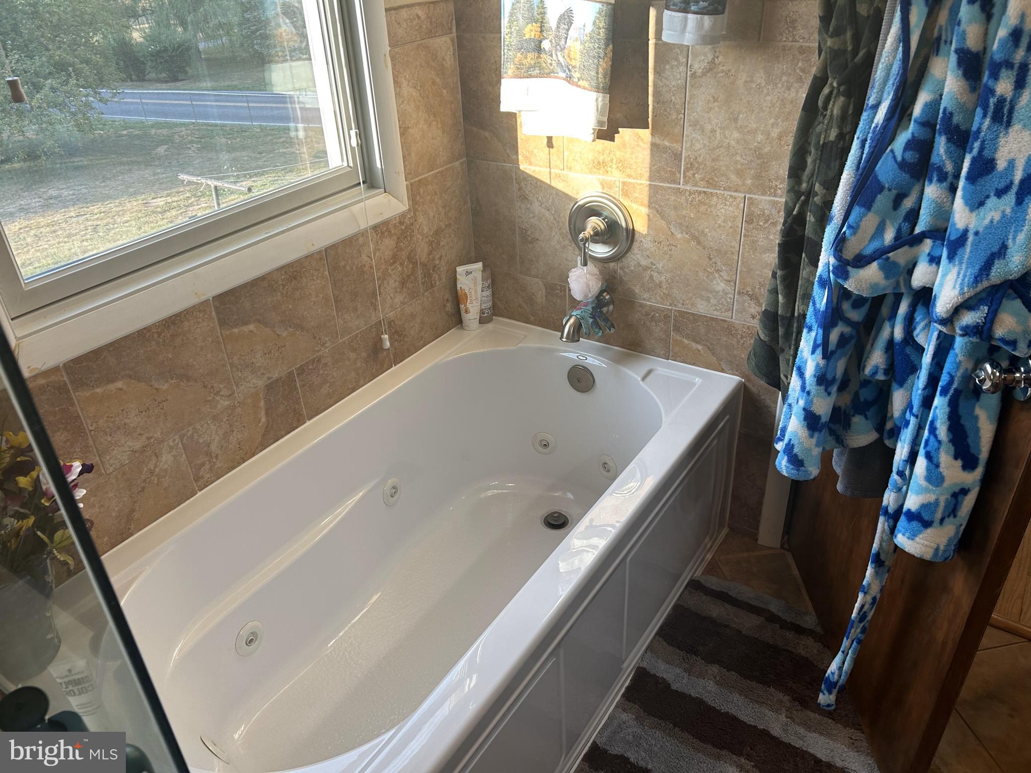 6423 Bikle Road Fayetteville, PA 17222 - Photo 20 of 56 a bath tub sitting next to a small sink