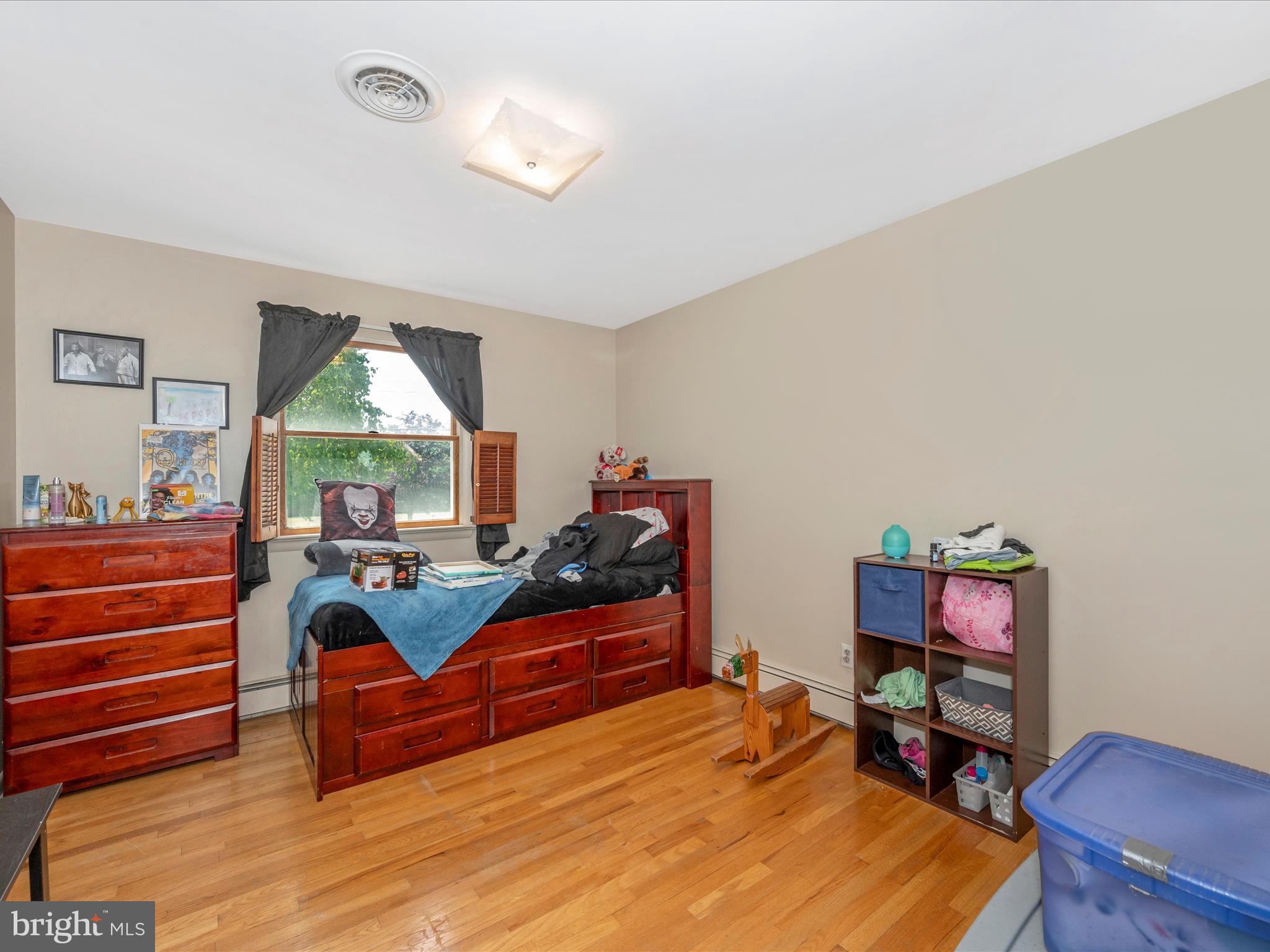 6423 Bikle Road Fayetteville, PA 17222 - Photo 23 of 56 a bedroom with furniture and a wooden floor