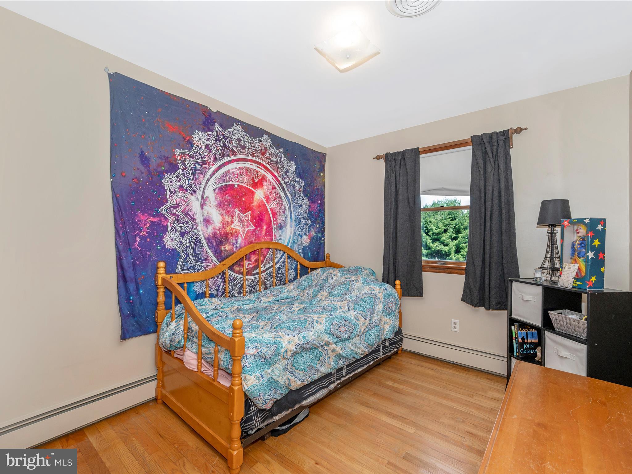 6423 Bikle Road Fayetteville, PA 17222 - Photo 25 of 56 a bedroom with a bed and dresser with wooden floor