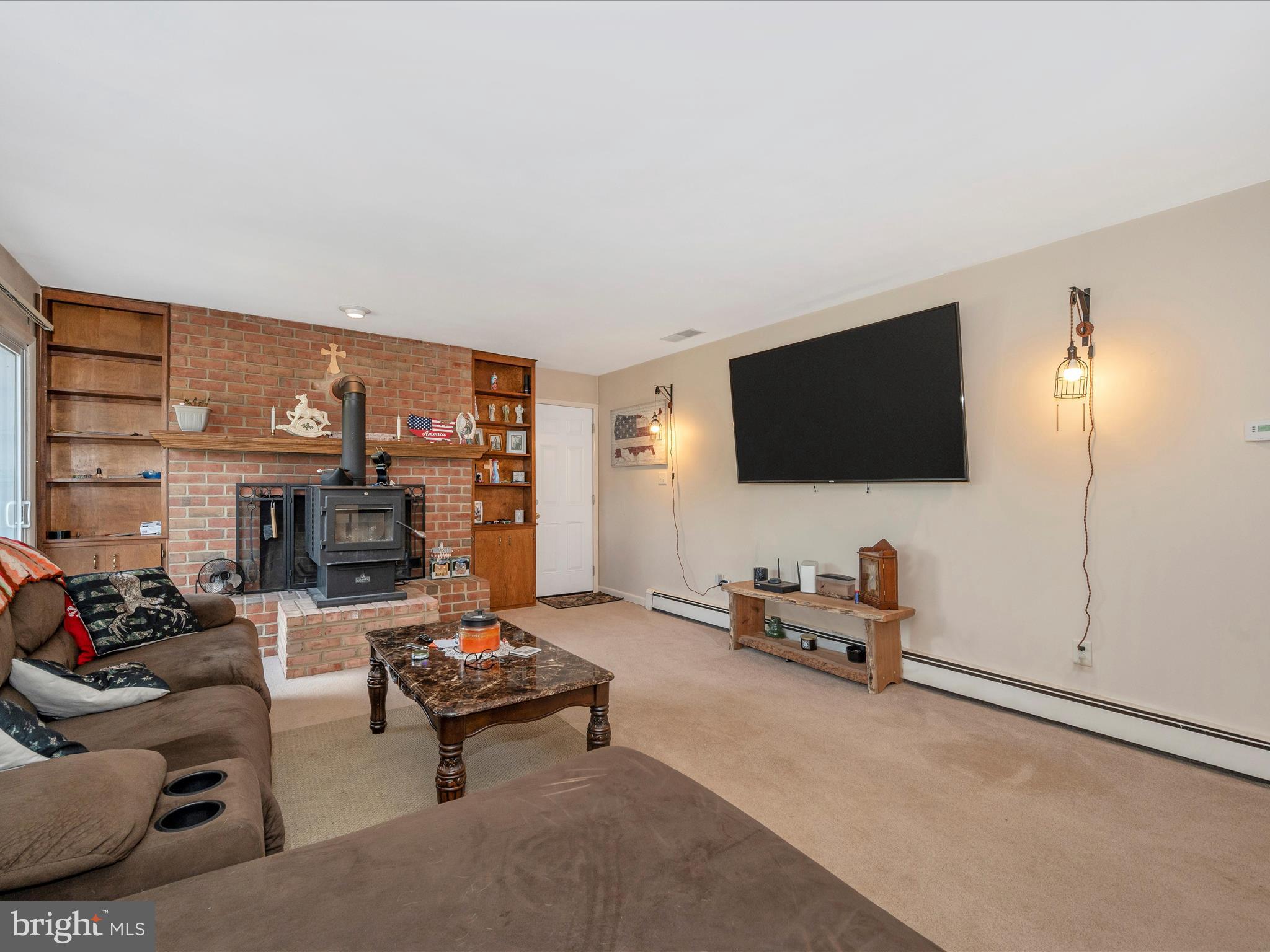 6423 Bikle Road Fayetteville, PA 17222 - Photo 29 of 56 a living room with furniture and a flat screen tv