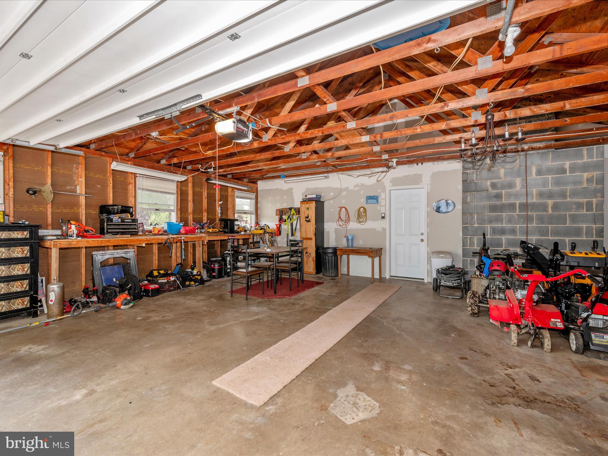 6423 Bikle Road Fayetteville, PA 17222 - Photo 41 of 56 a view of a garage with a table and chairs
