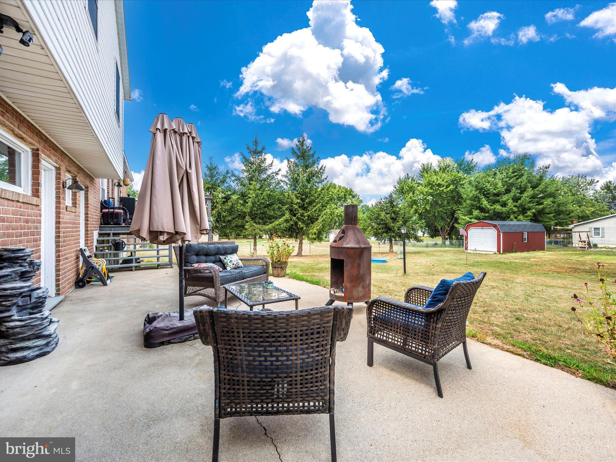 6423 Bikle Road Fayetteville, PA 17222 - Photo 42 of 56 a view of a patio with swimming pool table and chairs