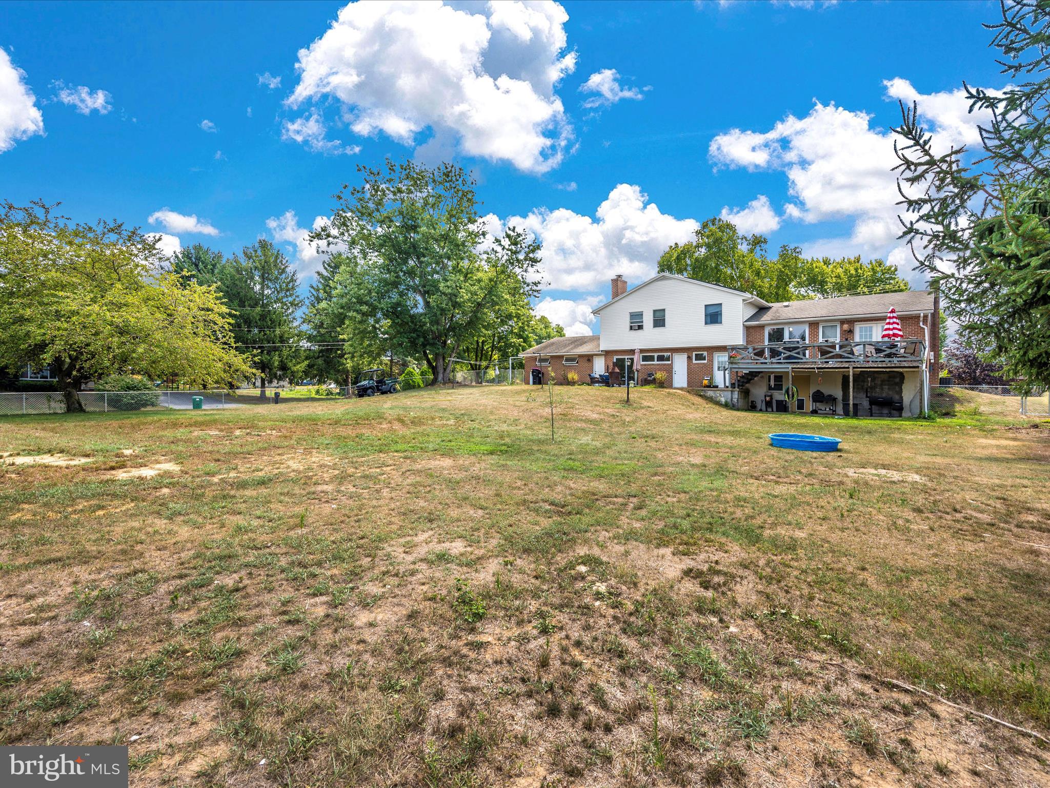 6423 Bikle Road Fayetteville, PA 17222 - Photo 47 of 56 a view of a house with swimming pool and trees in the background