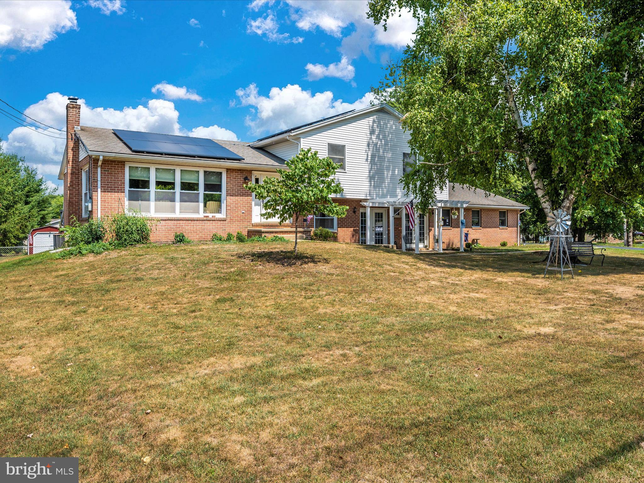 6423 Bikle Road Fayetteville, PA 17222 - Photo 49 of 56 a front view of a house with a yard balcony