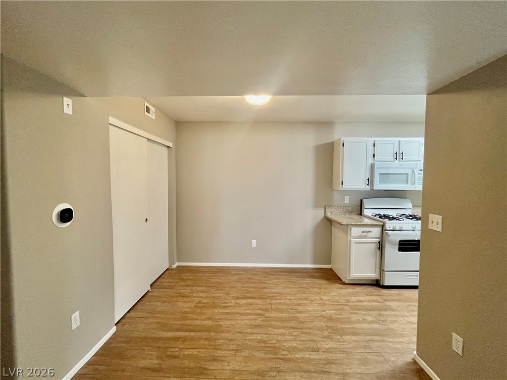 7885 West Flamingo Road, Unit 1029 Las Vegas, NV 89147 - Photo 6 of 18 Functional kitchen and dining area with practical flooring.