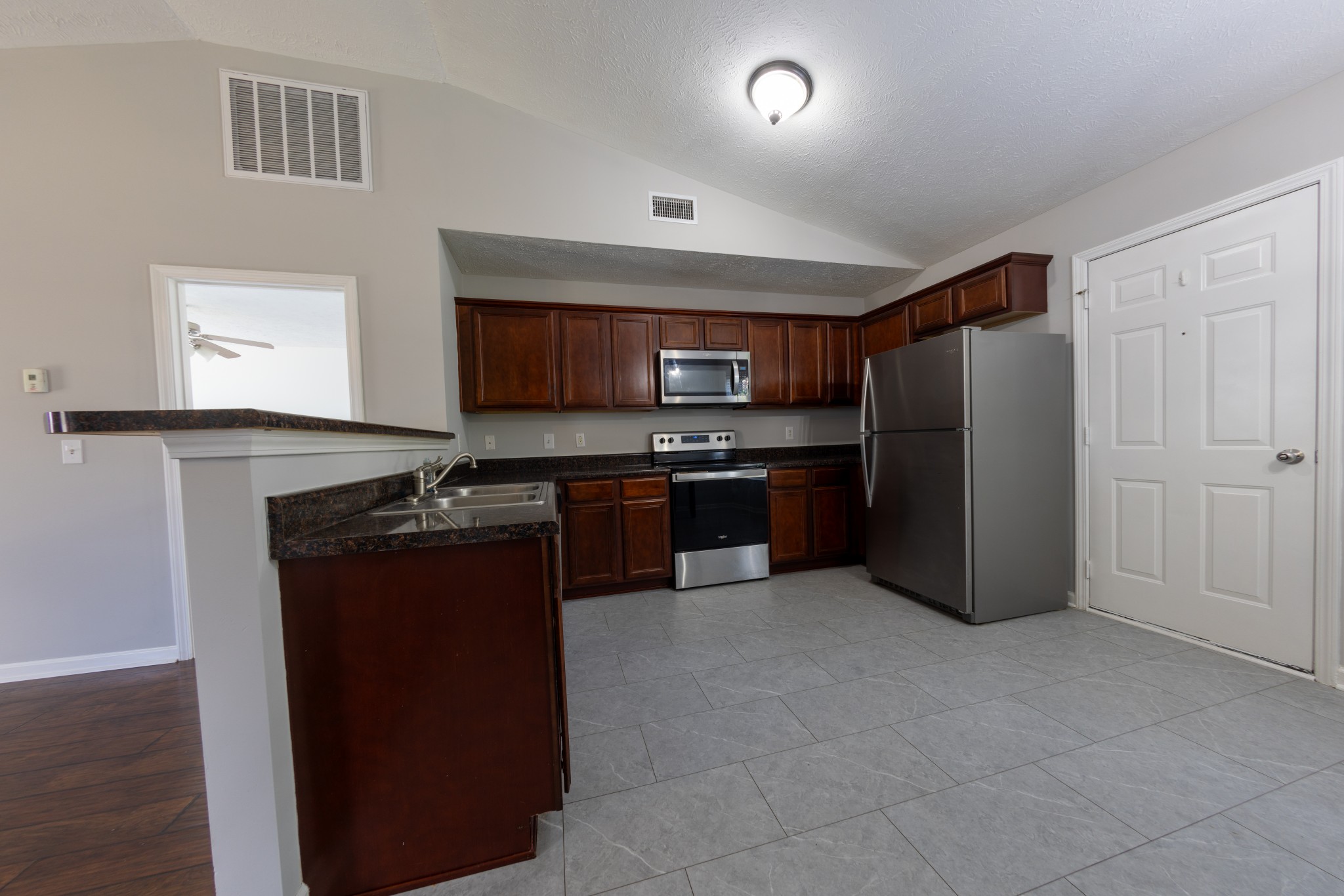 2003 Tabasco Way Murfreesboro, TN 37128 - Photo 2 of 6 a kitchen with stainless steel appliances granite countertop a refrigerator and a stove