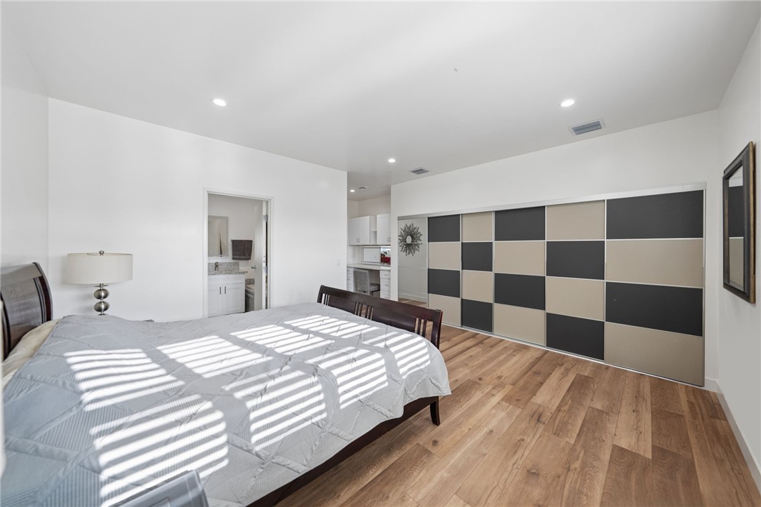 35825 Meadow Ridge Road Temecula, CA 92592 - Photo 71 of 75 a bedroom with a bed and a black white checkered floor