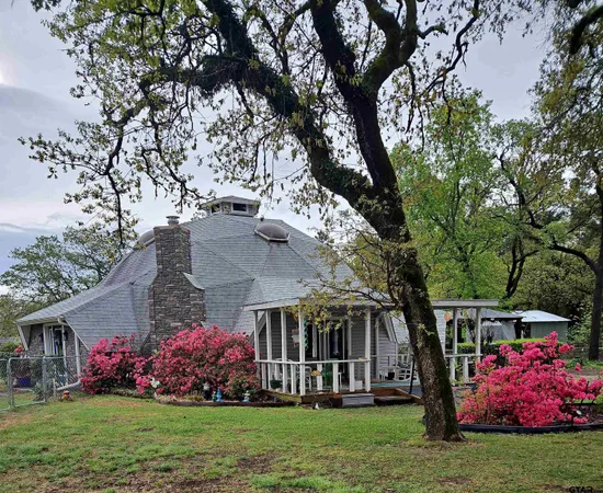 front view of a house with a garden