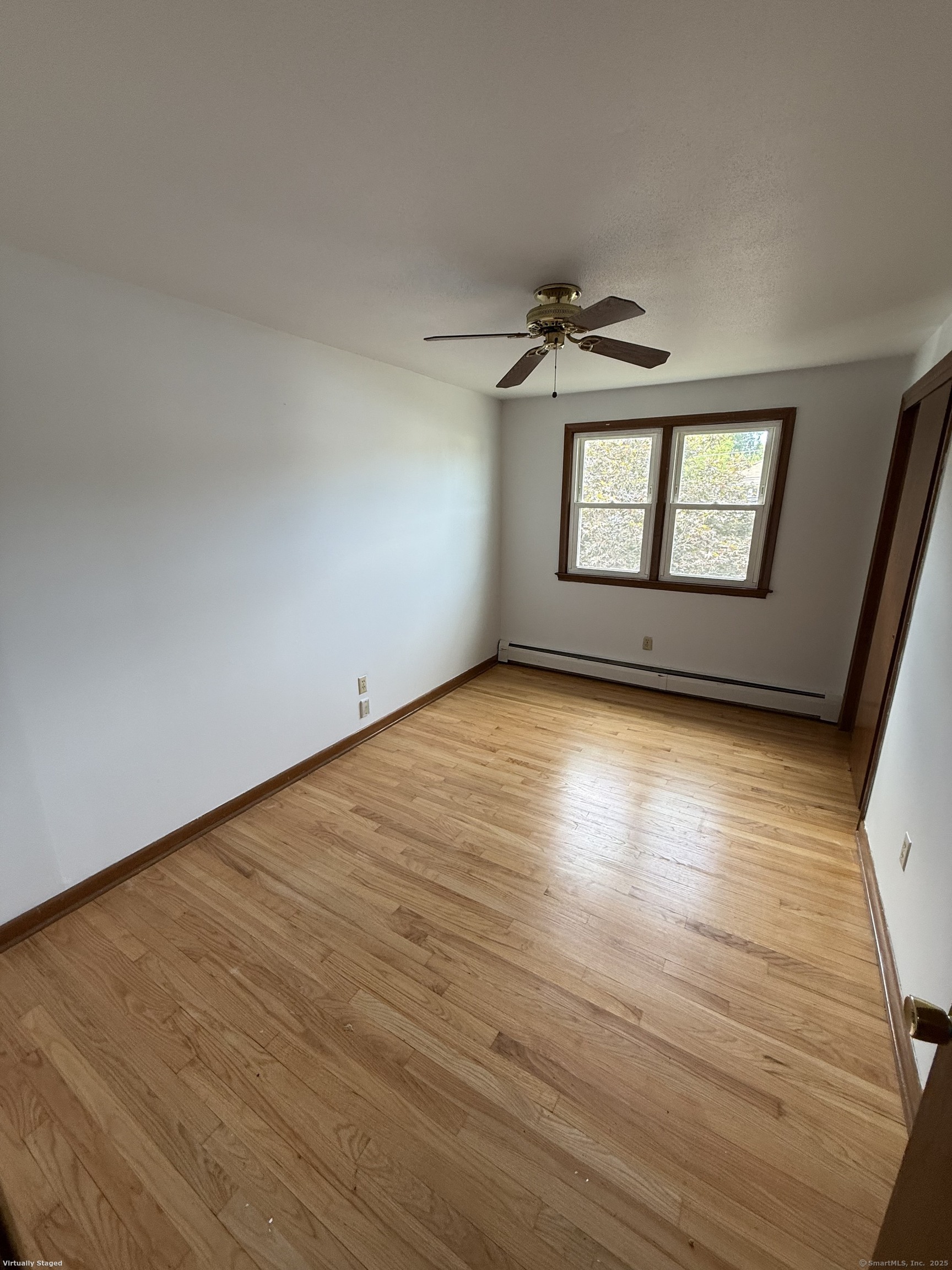 147 Overlook Avenue New Britain, CT 06053 - Photo 4 of 8 an empty room with wooden floor chandelier and windows