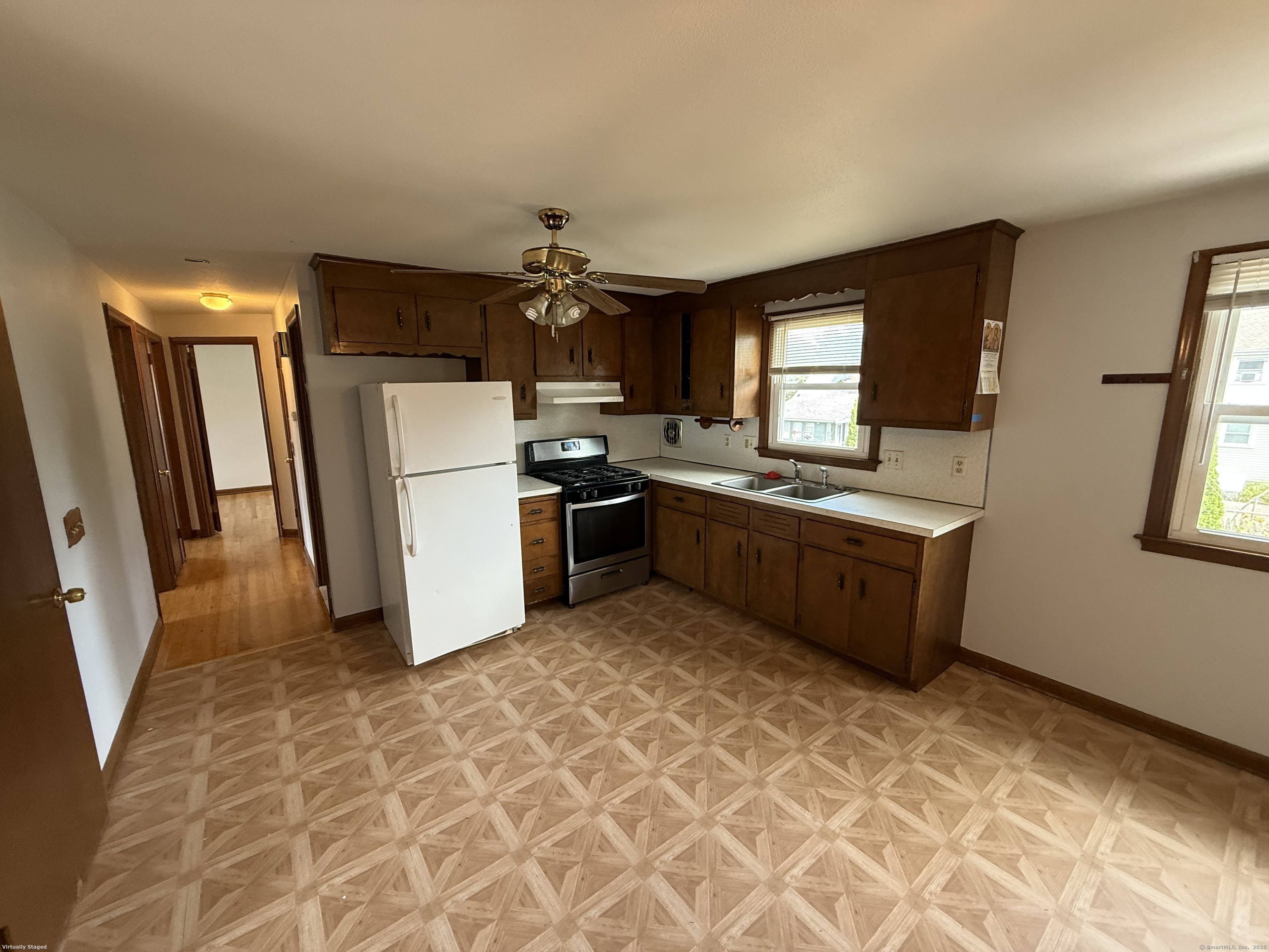 147 Overlook Avenue New Britain, CT 06053 - Photo 7 of 8 a kitchen with stainless steel appliances a stove a sink a refrigerator a window