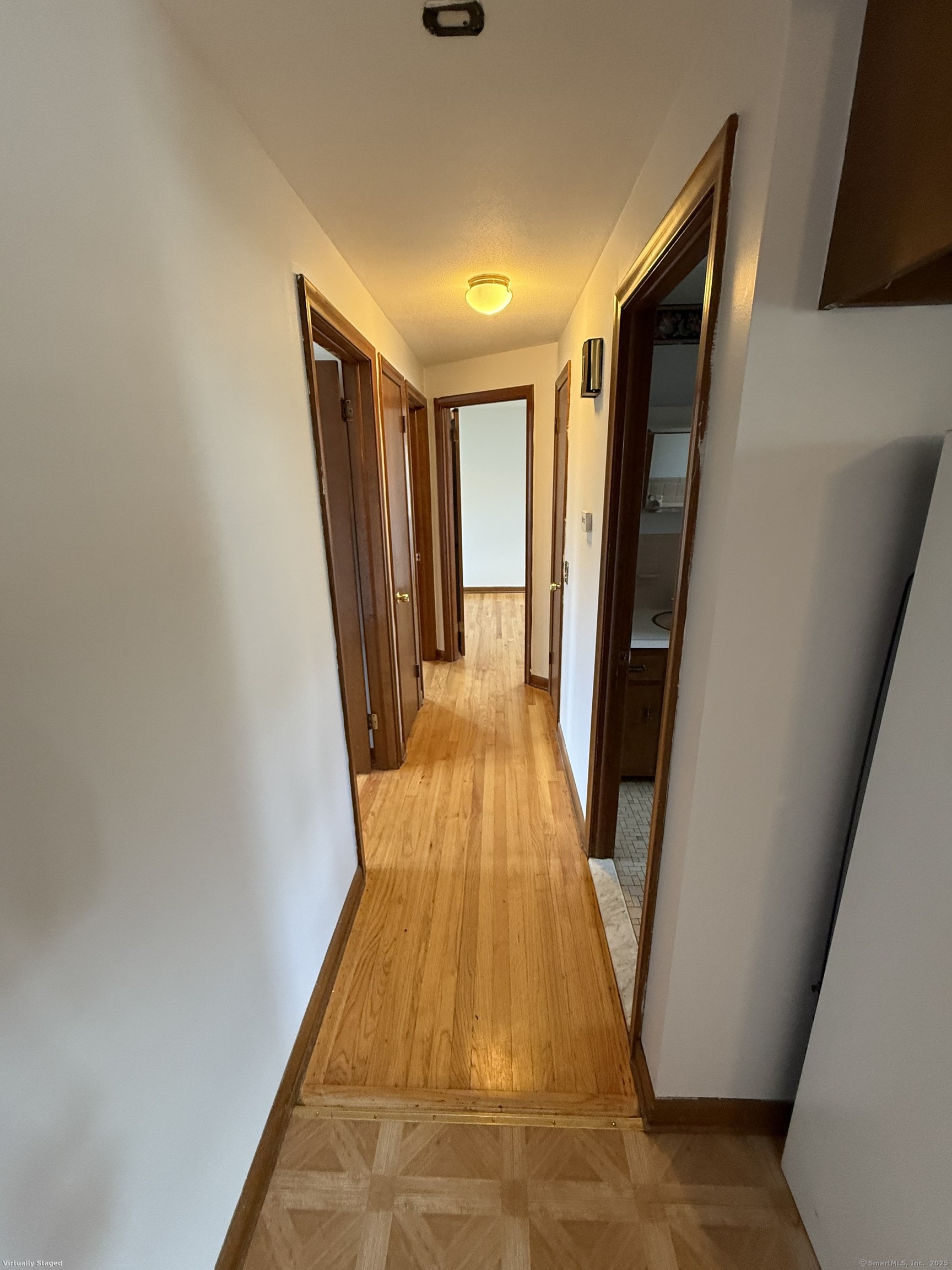 147 Overlook Avenue New Britain, CT 06053 - Photo 8 of 8 a view of a hallway with wooden floor and staircase