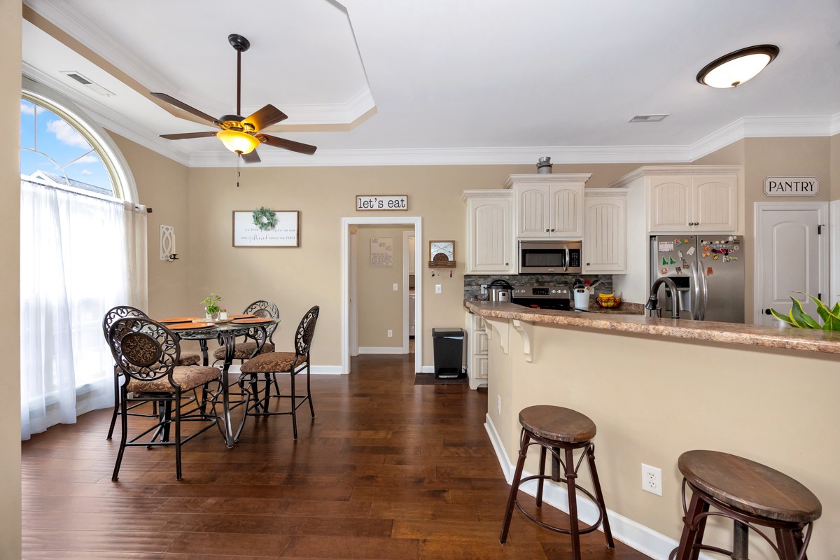 402 Vista Shores Road Rogersville, AL 35652 - Photo 14 of 55 a view of a dining room with furniture and wooden floor