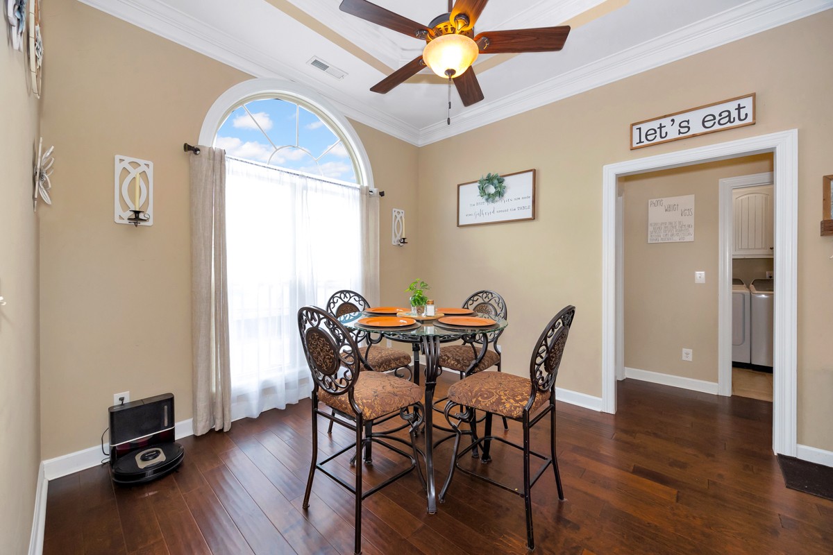 402 Vista Shores Road Rogersville, AL 35652 - Photo 15 of 55 a view of a dining room with furniture window and wooden floor