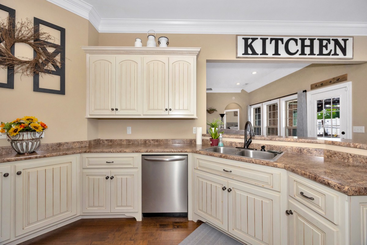 402 Vista Shores Road Rogersville, AL 35652 - Photo 21 of 55 a kitchen with white cabinets and sink
