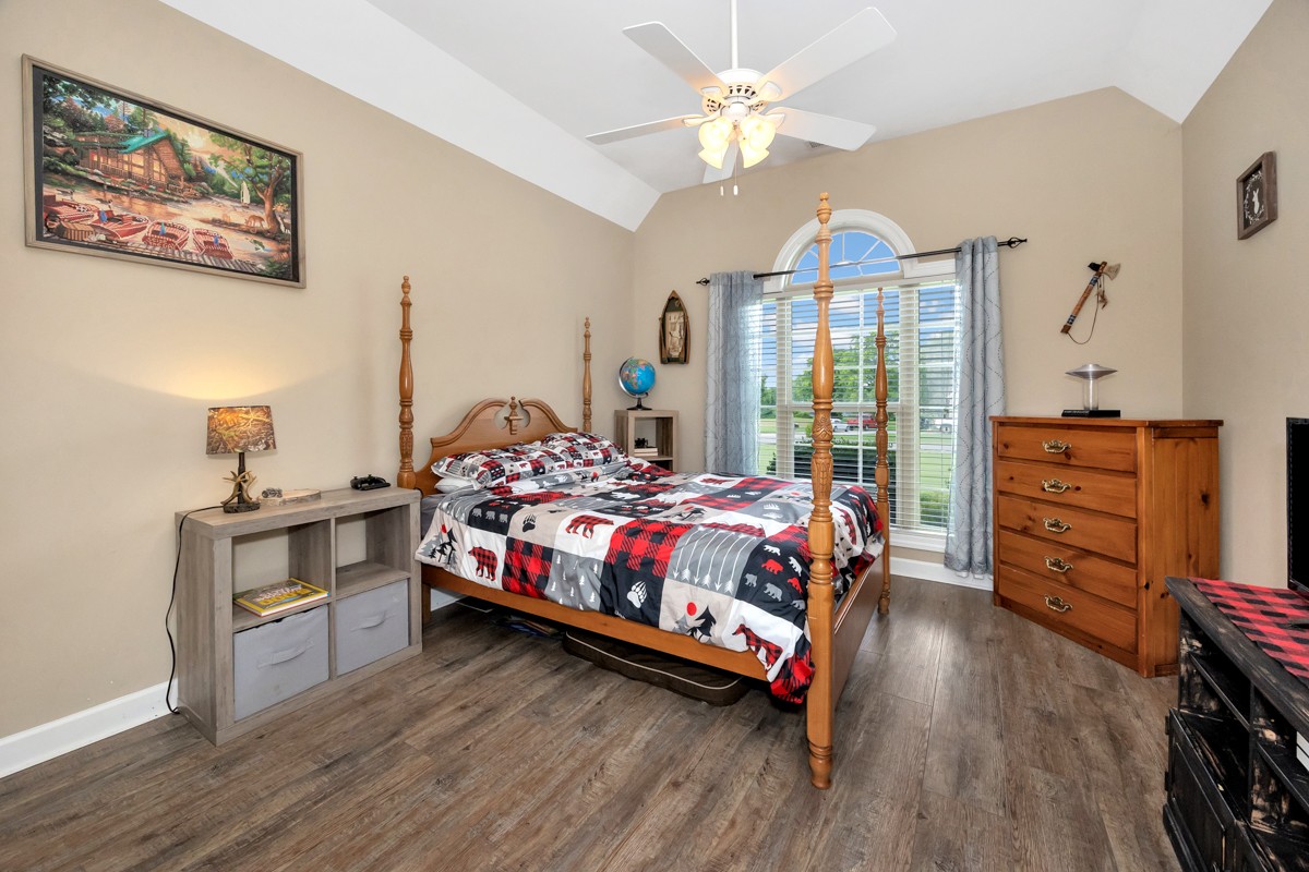 402 Vista Shores Road Rogersville, AL 35652 - Photo 22 of 55 a bedroom with a bed bookshelf and a window