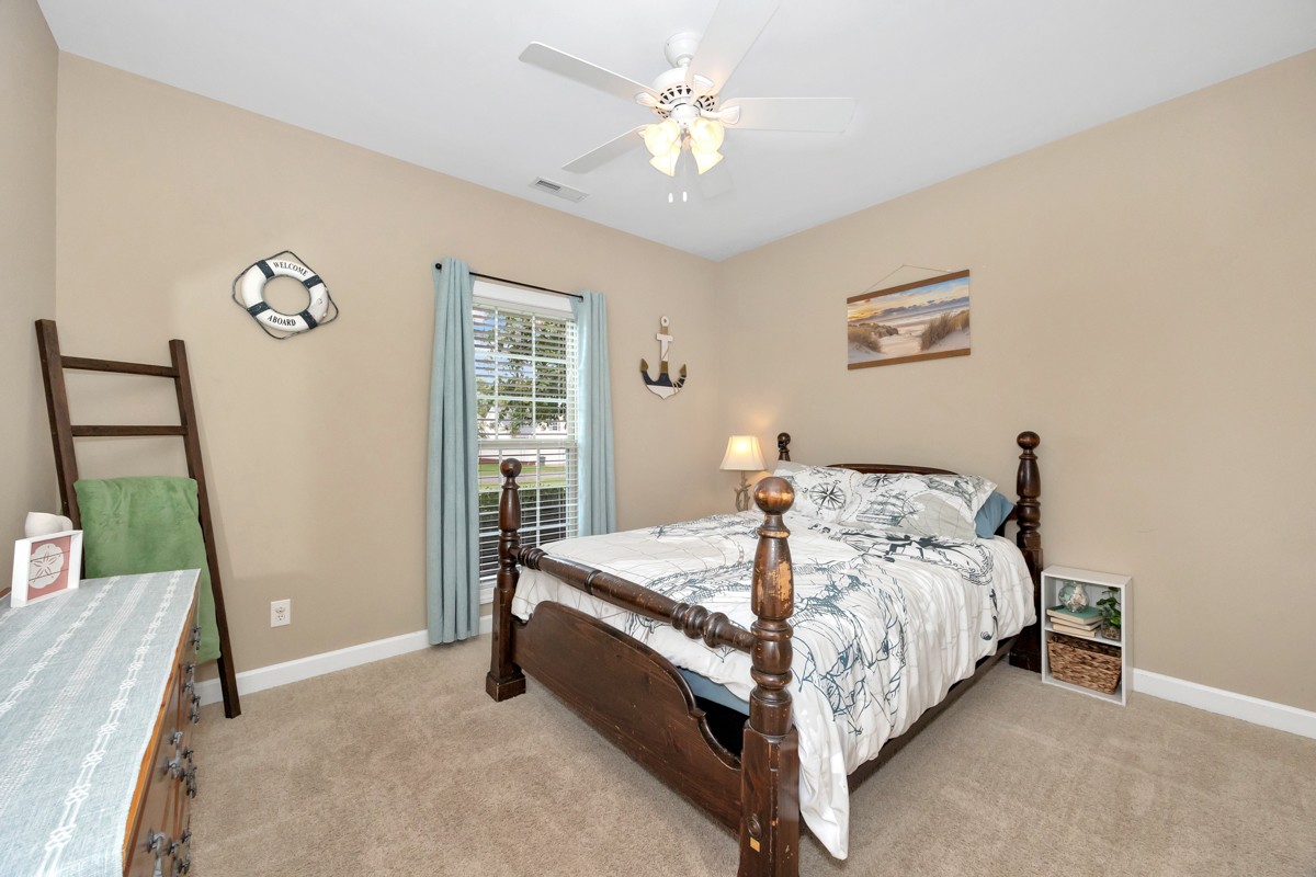 402 Vista Shores Road Rogersville, AL 35652 - Photo 24 of 55 a bed sitting in a bedroom next to a window