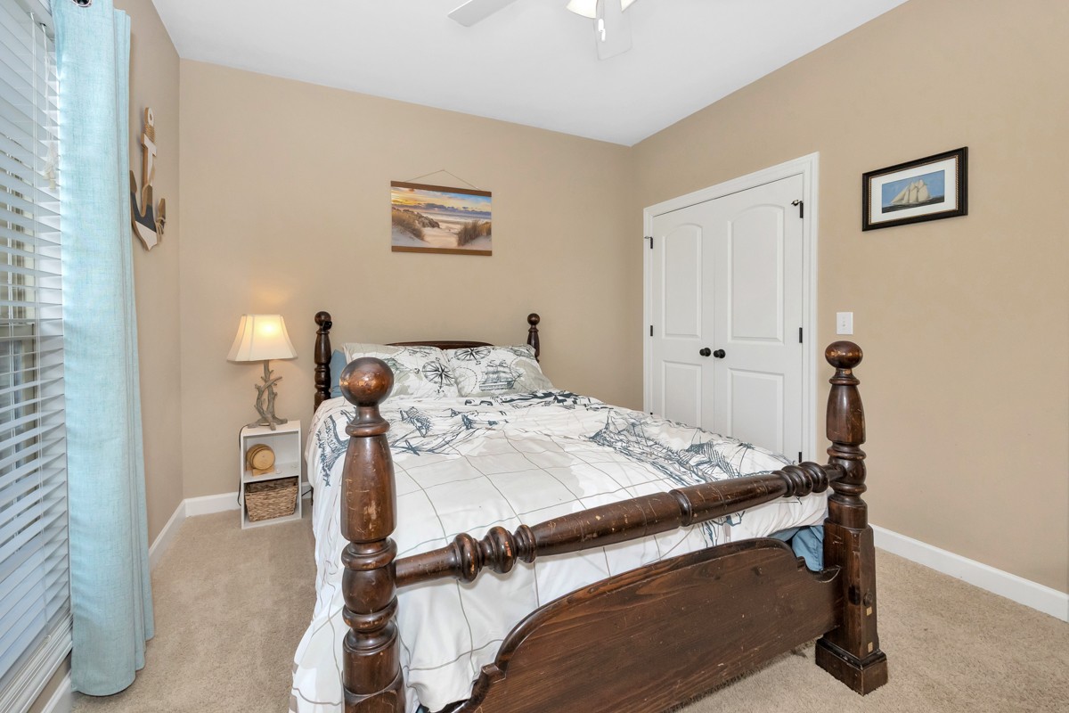 402 Vista Shores Road Rogersville, AL 35652 - Photo 25 of 55 a bed sitting in a bedroom next to a window