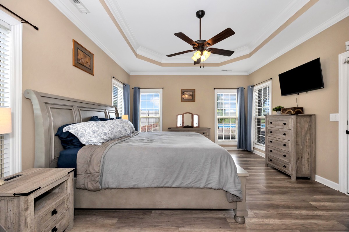 402 Vista Shores Road Rogersville, AL 35652 - Photo 28 of 55 a bedroom with a bed and a flat screen tv