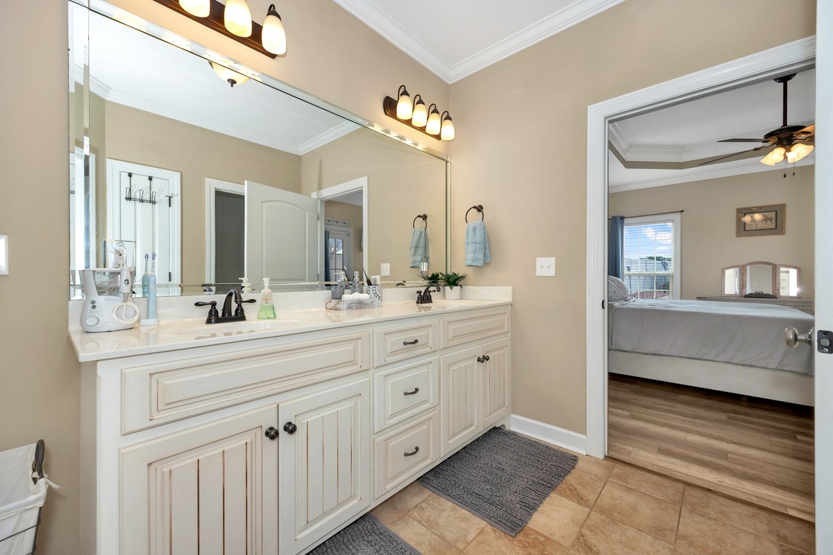 402 Vista Shores Road Rogersville, AL 35652 - Photo 30 of 55 a spacious bathroom with a double vanity sink a mirror and a