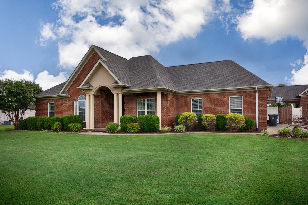 402 Vista Shores Road Rogersville, AL 35652 - Photo 33 of 55 a front view of a house with garden