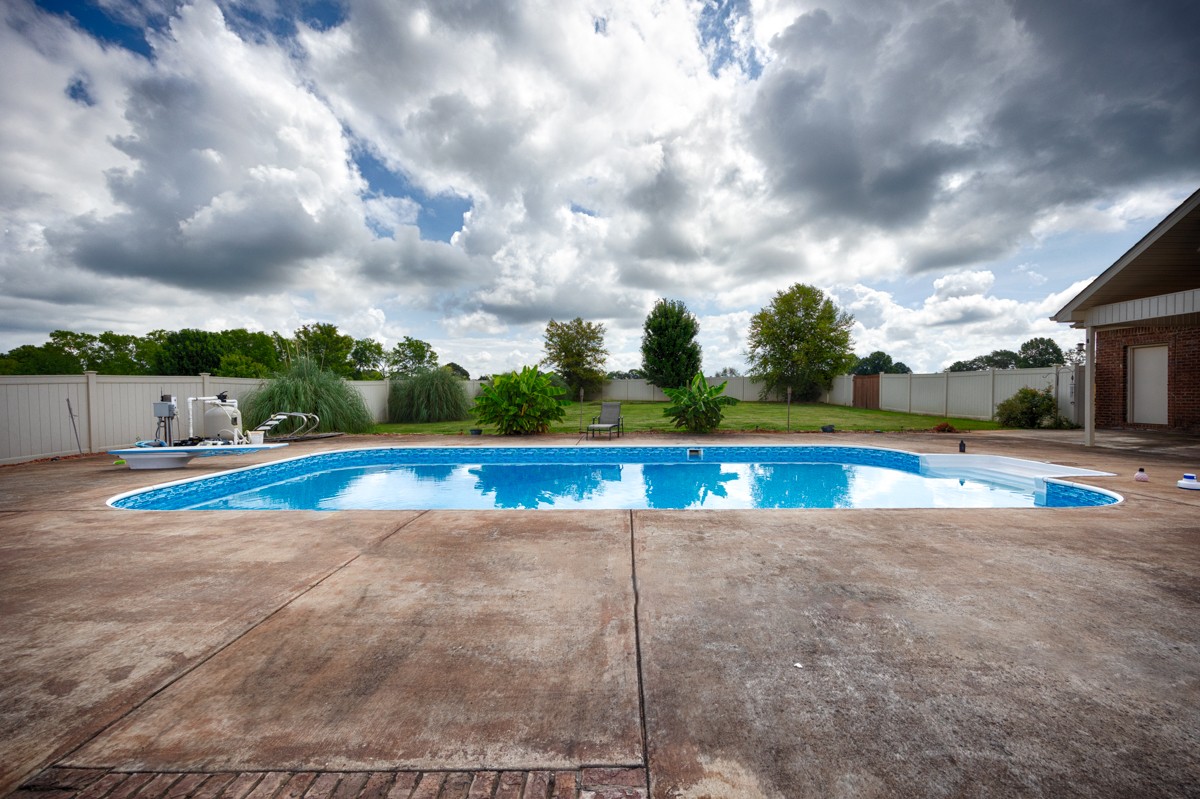 402 Vista Shores Road Rogersville, AL 35652 - Photo 36 of 55 a view of a swimming pool and a yard