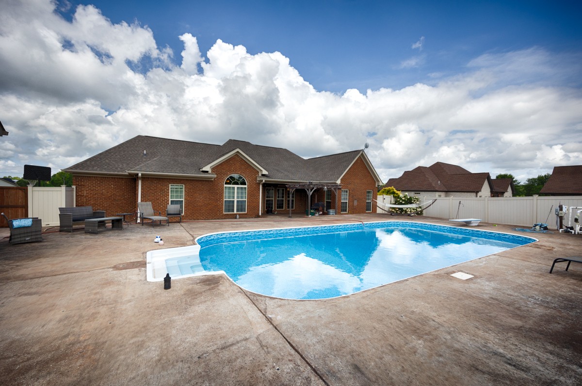 402 Vista Shores Road Rogersville, AL 35652 - Photo 40 of 55 a view of a house with swimming pool and sitting area