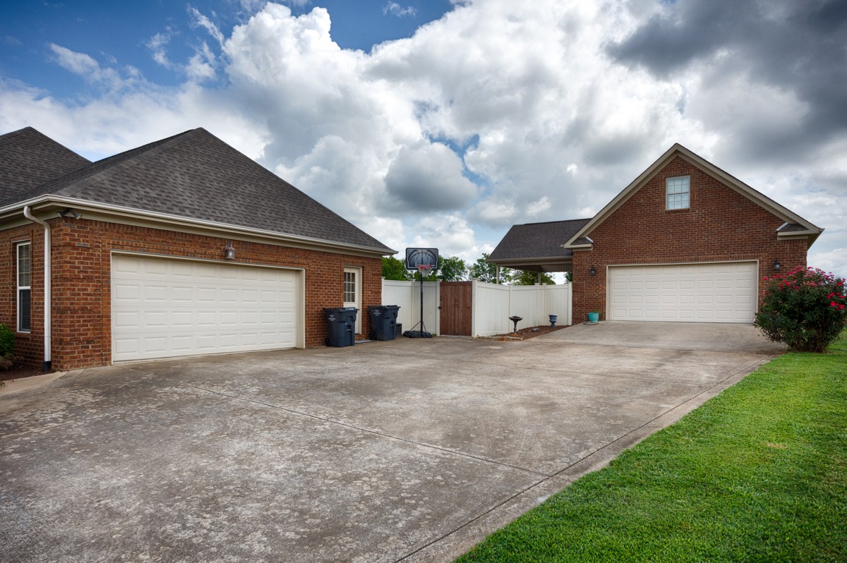 402 Vista Shores Road Rogersville, AL 35652 - Photo 45 of 55 a front view of a house with a yard and garage