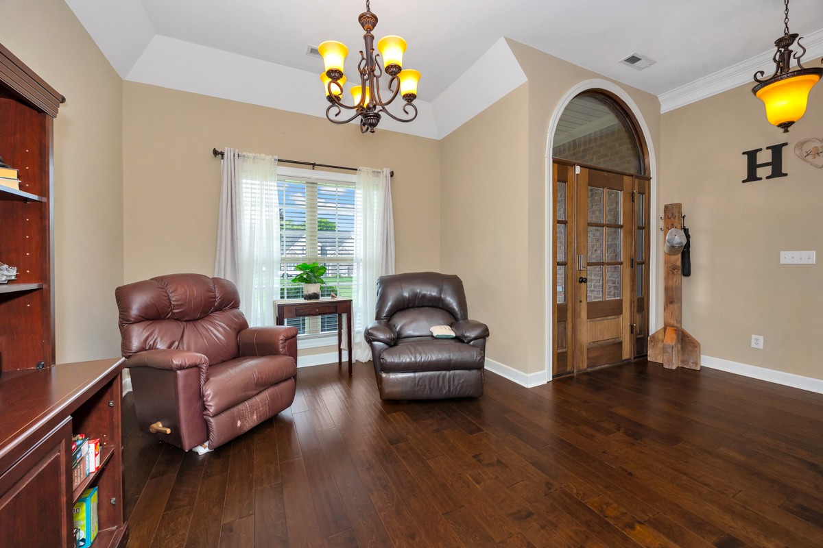 402 Vista Shores Road Rogersville, AL 35652 - Photo 6 of 55 a living room with furniture and a chandelier