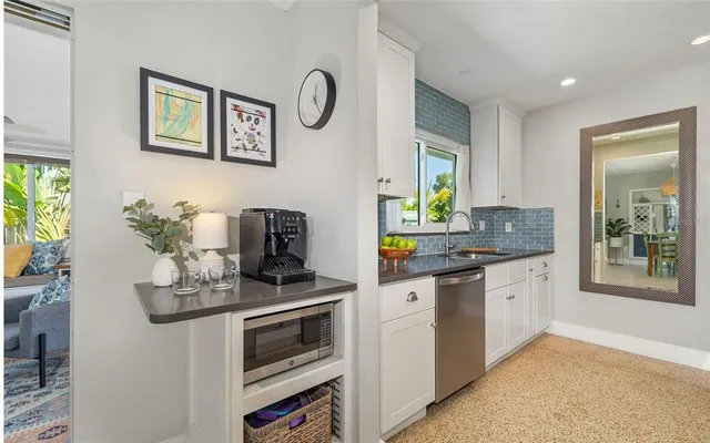 a kitchen with stainless steel appliances granite countertop a stove and a sink