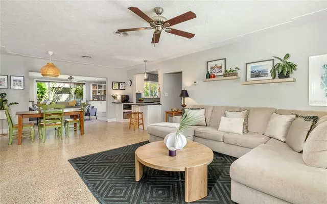 a living room with furniture and a table