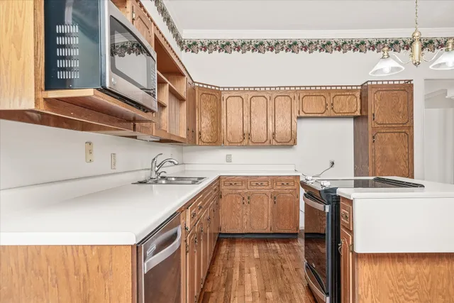 a bathroom with a sink a toilet a shower and a mirror