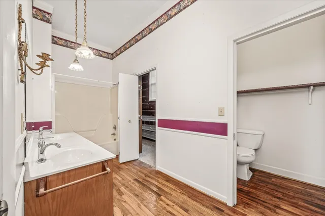 a bathroom with a sink a vanity and a mirror