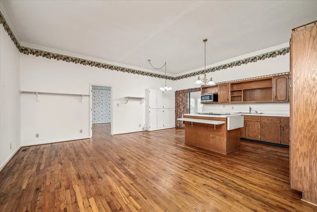 a view of a kitchen with a sink and cabinets
