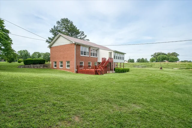 a spacious bedroom with a bed and a view of bathroom