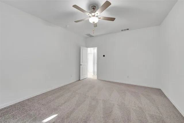 a bathroom that has a glass shower door