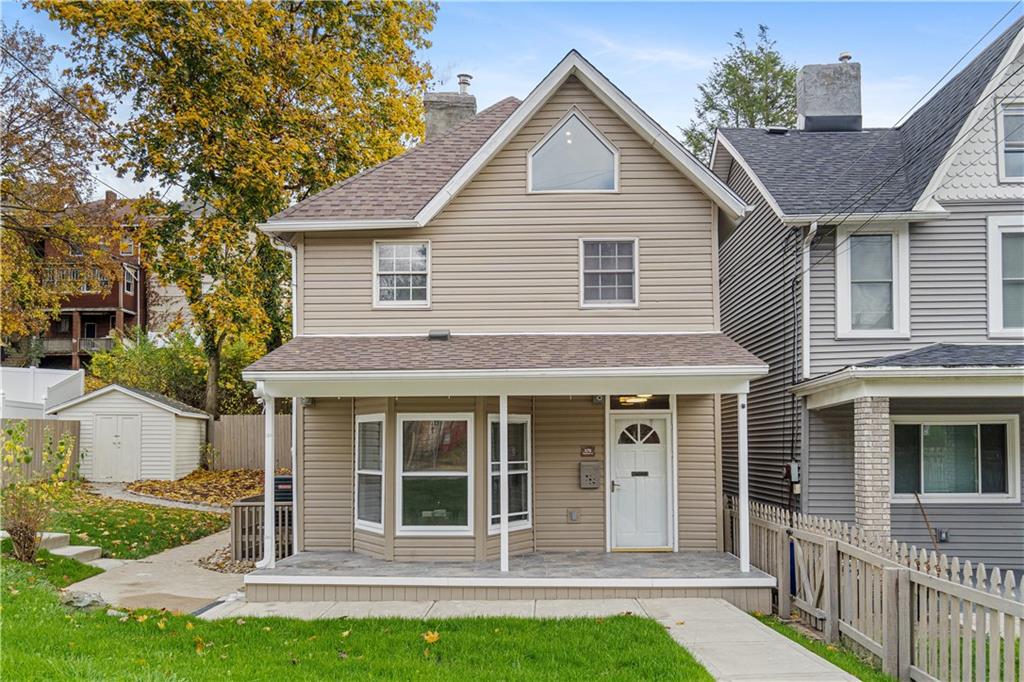 a front view of a house with a yard