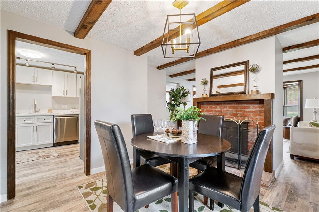 179 Merrimac Street Pittsburgh, PA 15211 - Photo 12 of 37 a view of a dining room with furniture and wooden floor