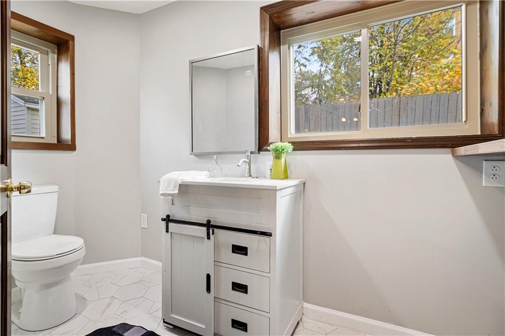 179 Merrimac Street Pittsburgh, PA 15211 - Photo 13 of 37 a bathroom with a sink toilet and window