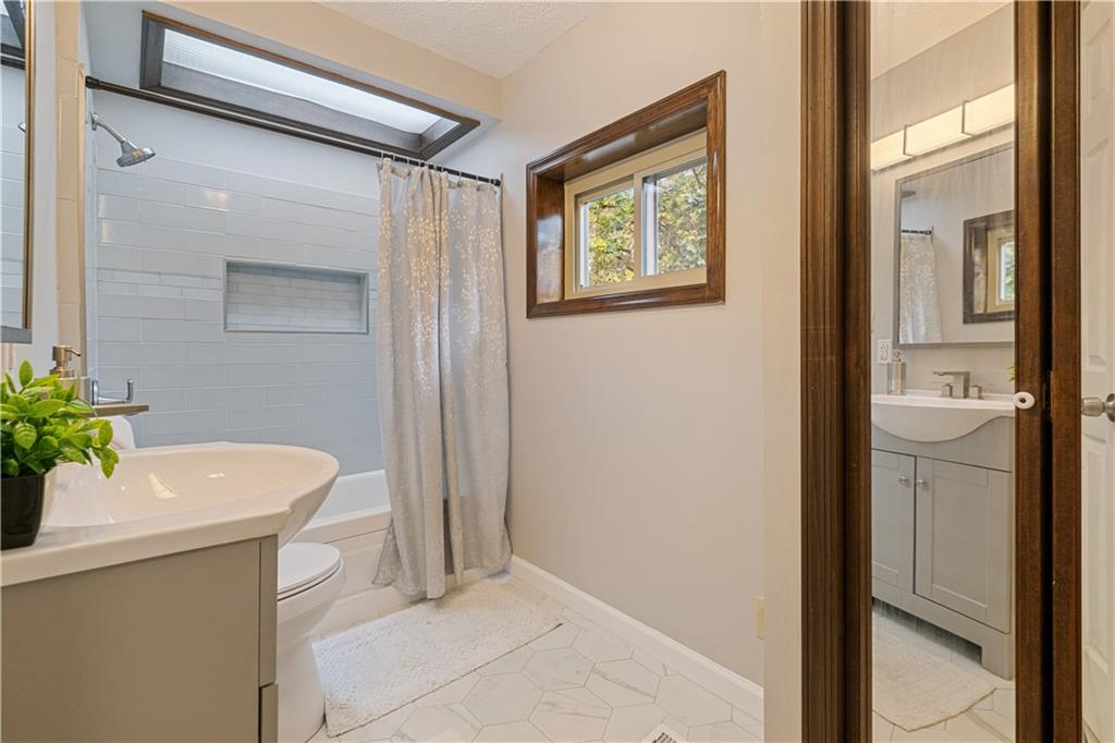 179 Merrimac Street Pittsburgh, PA 15211 - Photo 24 of 37 a bathroom with a sink and a mirror