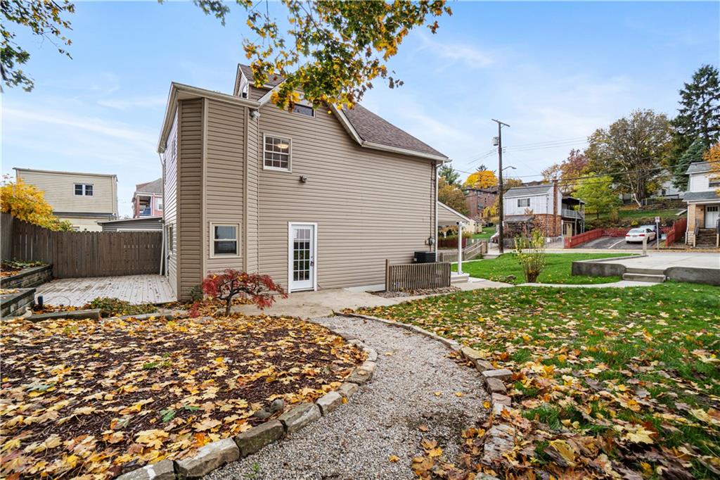 179 Merrimac Street Pittsburgh, PA 15211 - Photo 34 of 37 a front view of a house with a yard