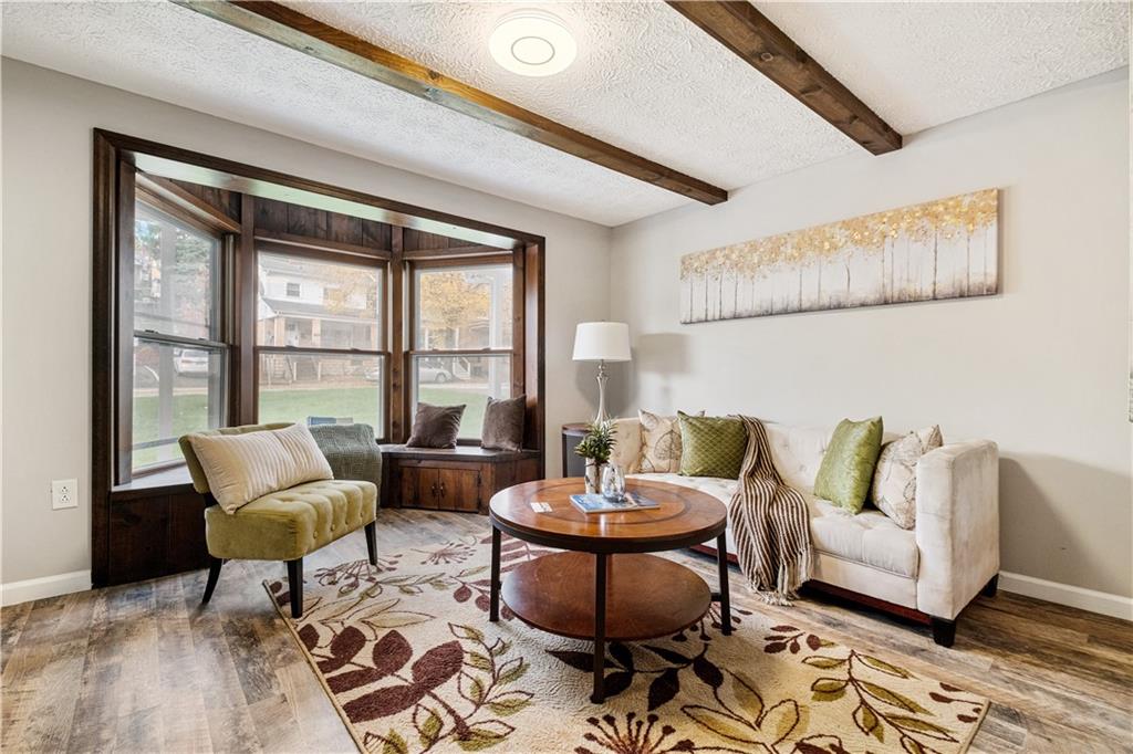 179 Merrimac Street Pittsburgh, PA 15211 - Photo 7 of 37 a living room with furniture and a large window