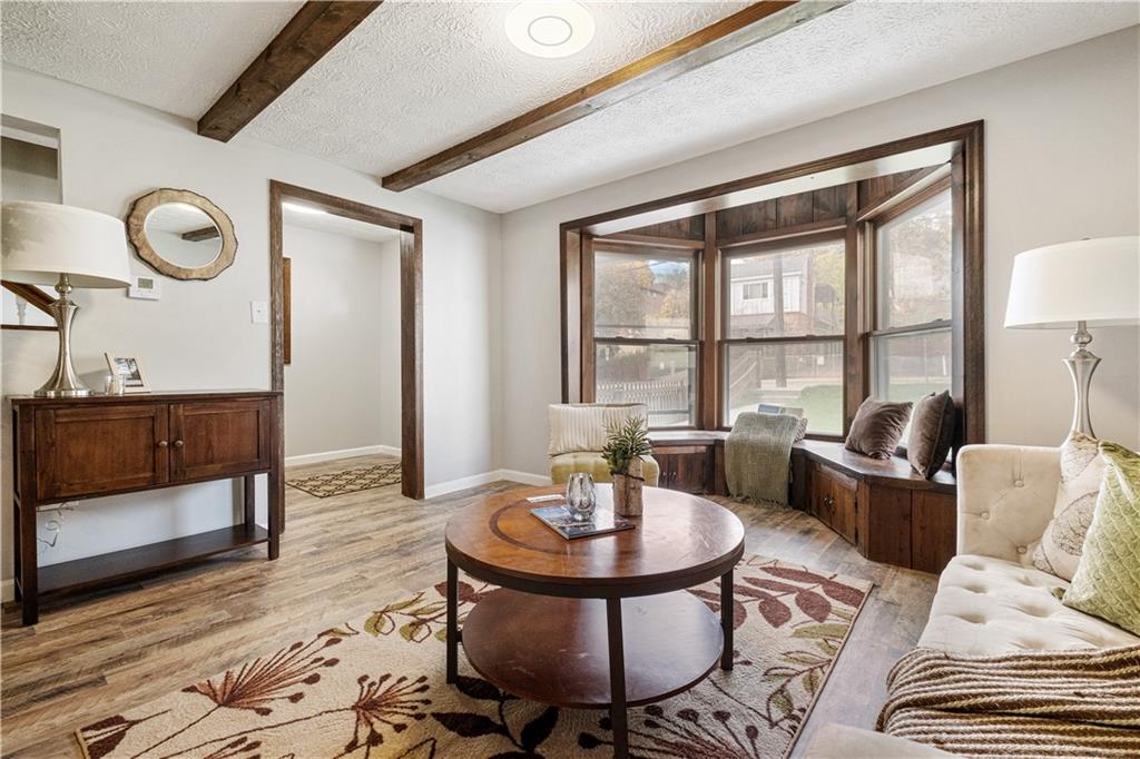 179 Merrimac Street Pittsburgh, PA 15211 - Photo 8 of 37 a living room with furniture and a table