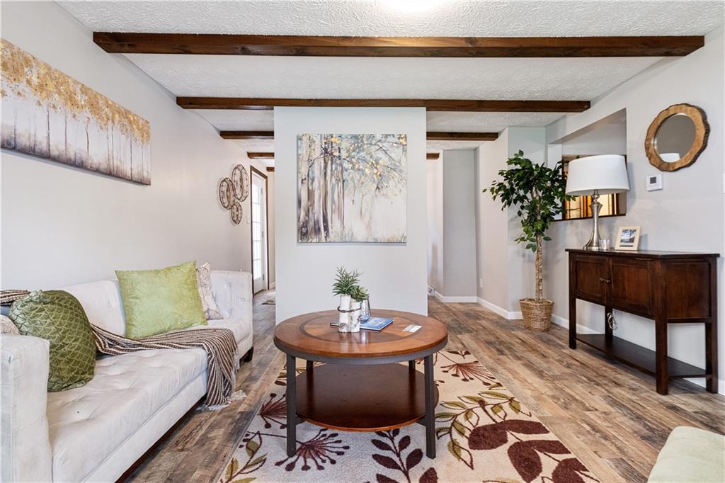 179 Merrimac Street Pittsburgh, PA 15211 - Photo 9 of 37 a living room with furniture and a mirror
