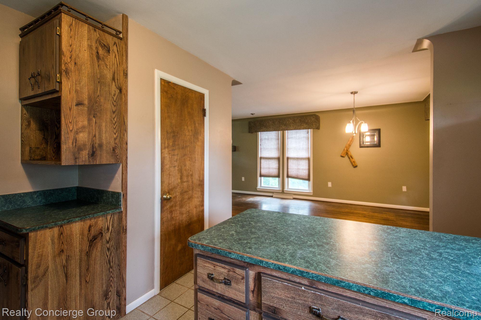 7525 Challis Road Brighton, MI 48116 - Photo 6 of 20 Enjoy additional seating at the island counter
