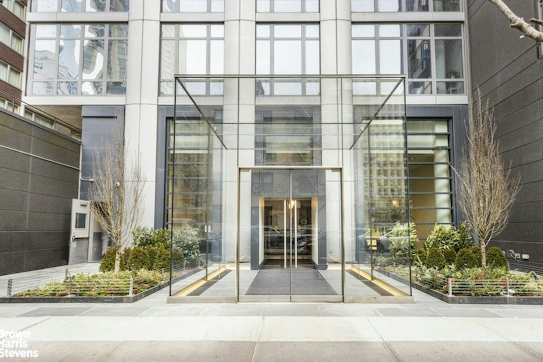 310 West 52nd Street, Unit 5B Manhattan, NY 10019 - Photo 14 of 15 a black and white building with a outdoor view